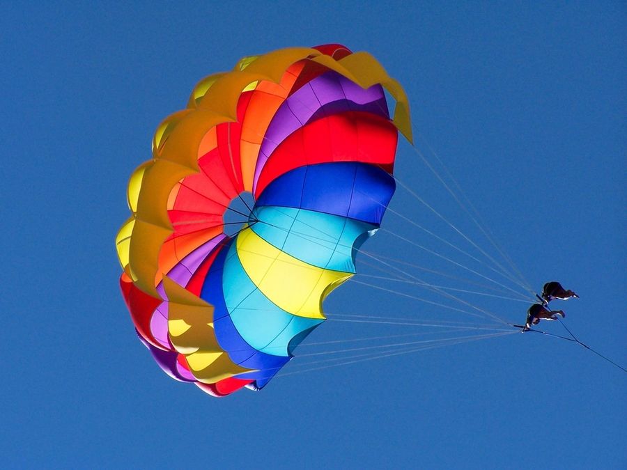Rainbow parasail over blue water